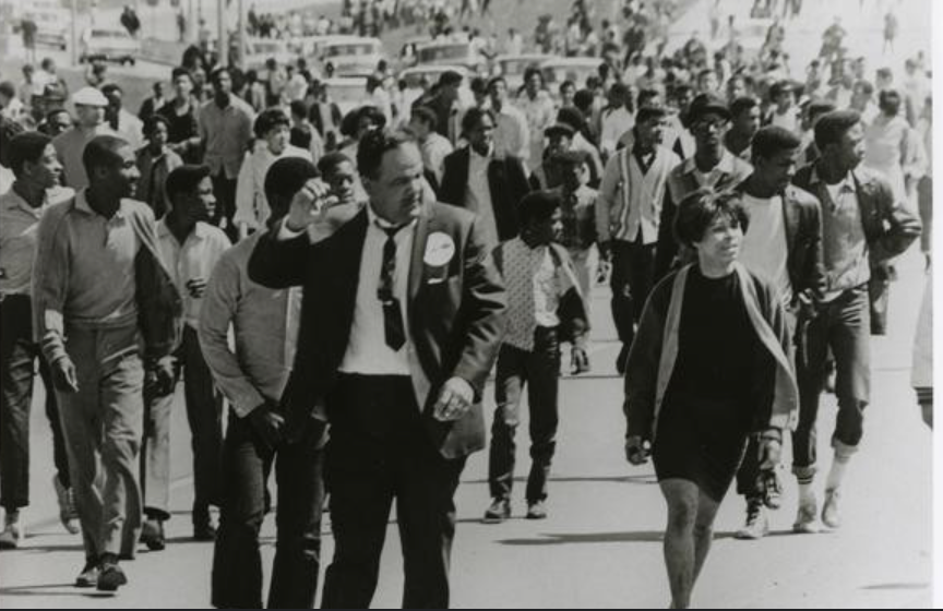 Missouri black men and women walking and protesting